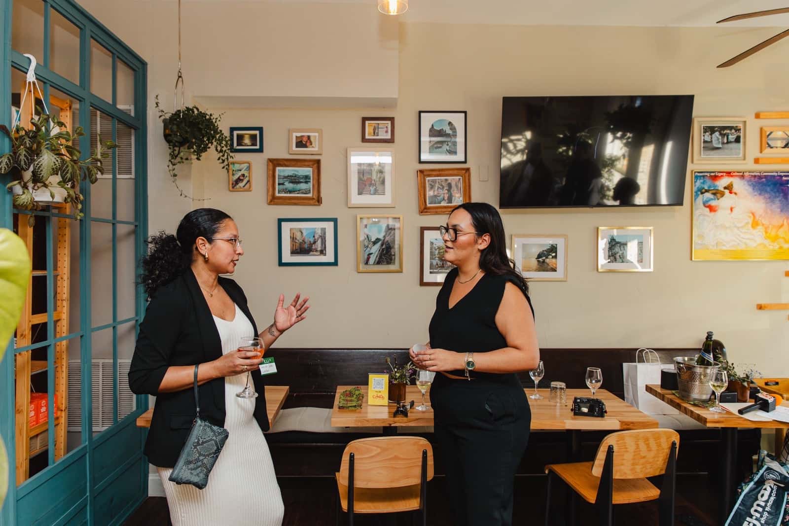 Two guests exchanging contacts at the first Colado Latino Network event in Baltimore